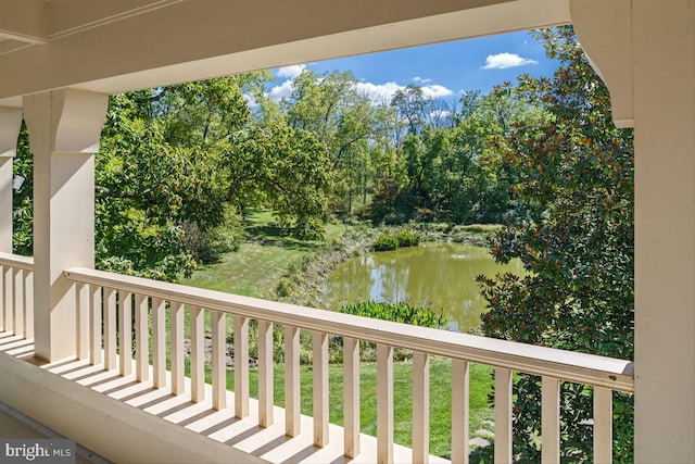 balcony featuring a water view