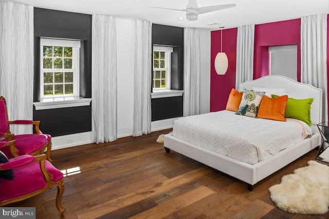 bedroom featuring dark wood-type flooring and ceiling fan