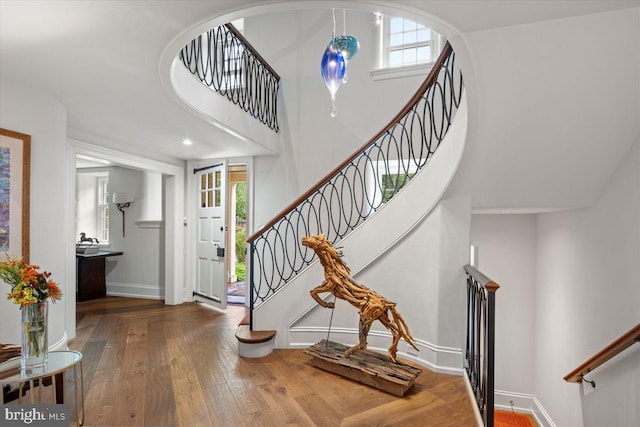 720 Swedesford Rd, Lower Gwynedd, PA 19002 - foyer entrance with hardwood / wood-style floors, stairway, baseboards, and plenty of natural light
