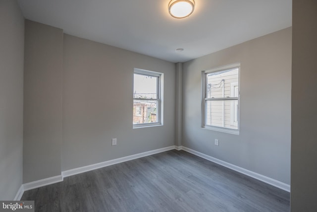 spare room featuring dark hardwood / wood-style flooring