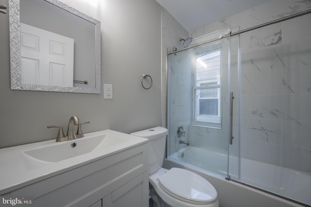 full bathroom featuring vanity, toilet, and enclosed tub / shower combo