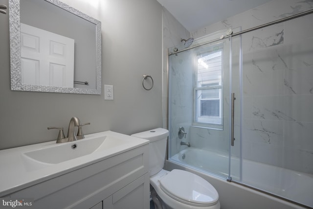 1823 N Caroline St, Baltimore, MD 21213 - full bath featuring toilet, vanity, and combined bath / shower with glass door