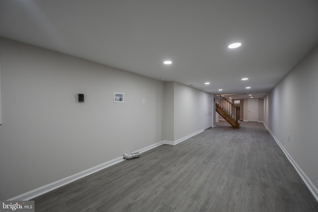 1823 N Caroline St, Baltimore, MD 21213 - finished basement with dark wood-style flooring, recessed lighting, stairway, and baseboards