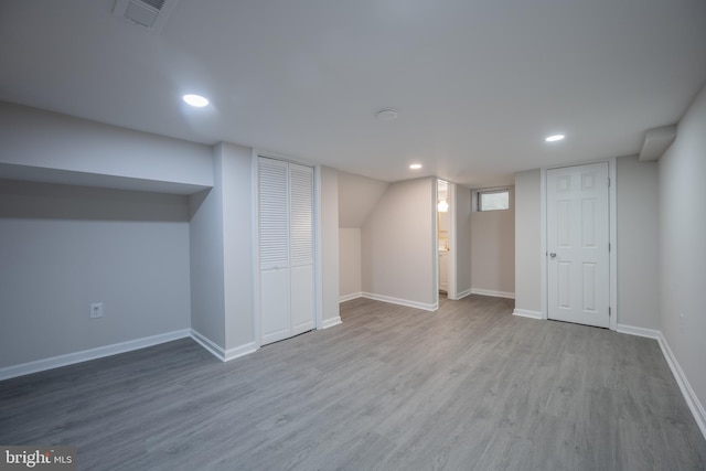 basement with light wood-type flooring