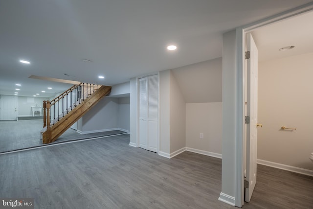 basement with hardwood / wood-style flooring