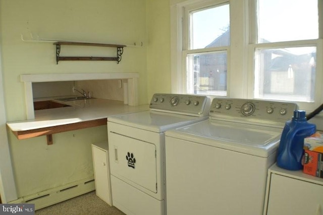 laundry area featuring separate washer and dryer and a baseboard heating unit