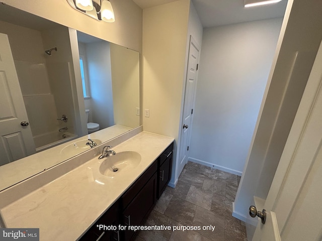 full bathroom featuring vanity, tub / shower combination, and toilet