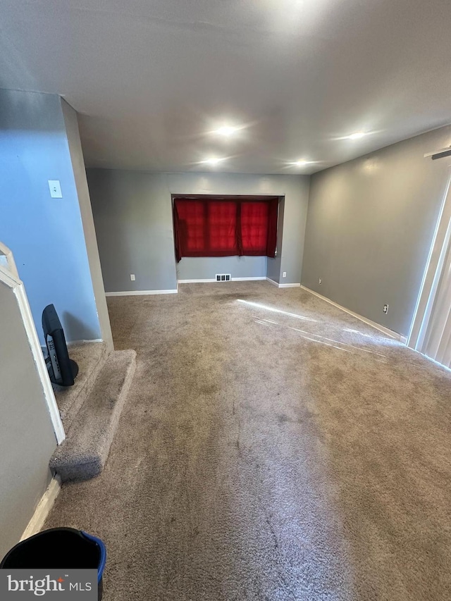 unfurnished living room with carpet