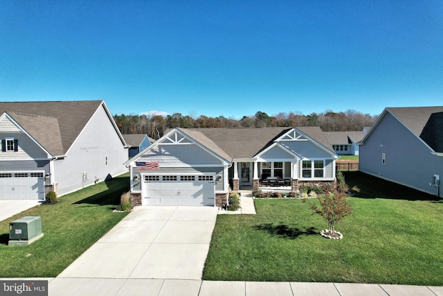 craftsman inspired home featuring a front yard and covered porch