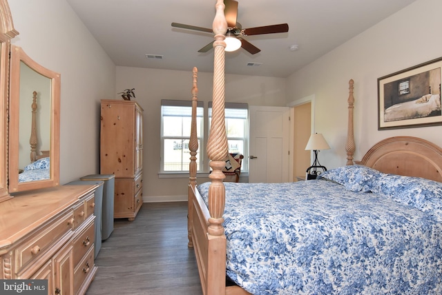 bedroom featuring ceiling fan and dark hardwood / wood-style floors