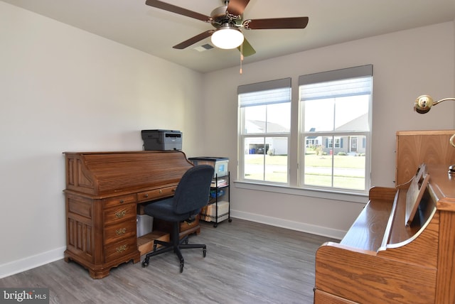 office with ceiling fan and dark hardwood / wood-style floors