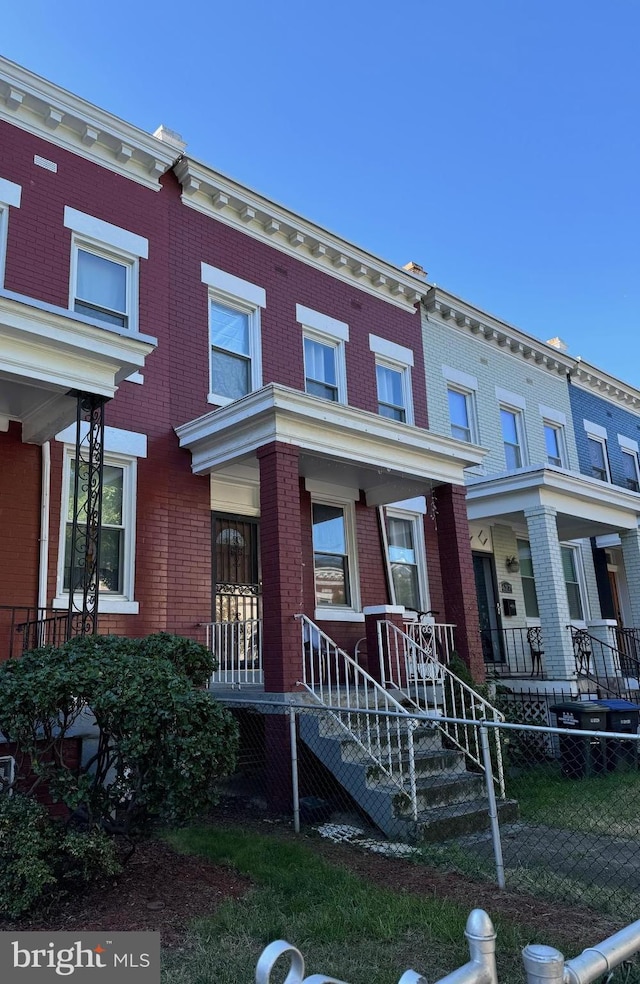 townhome / multi-family property featuring a porch