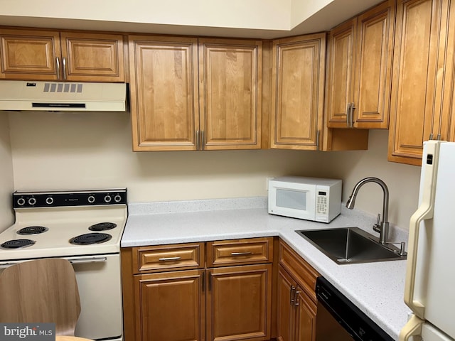 kitchen with white appliances and sink