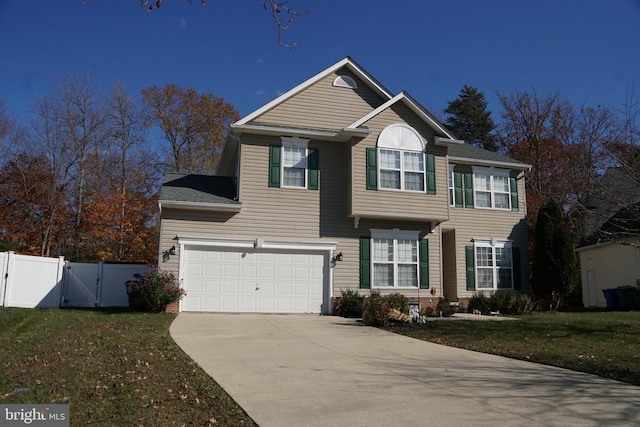 view of front facade with a front lawn and a garage