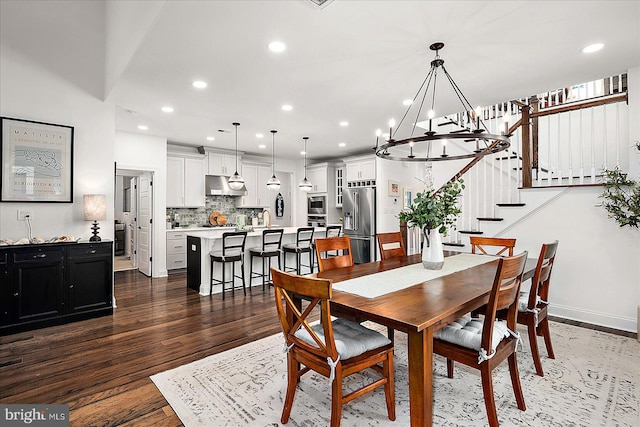 dining room featuring baseboards, stairway, wood finished floors, and recessed lighting