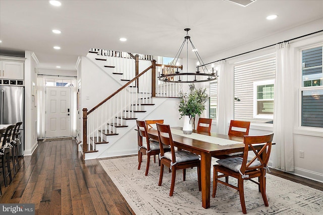 dining room with dark wood-style floors, stairs, and recessed lighting