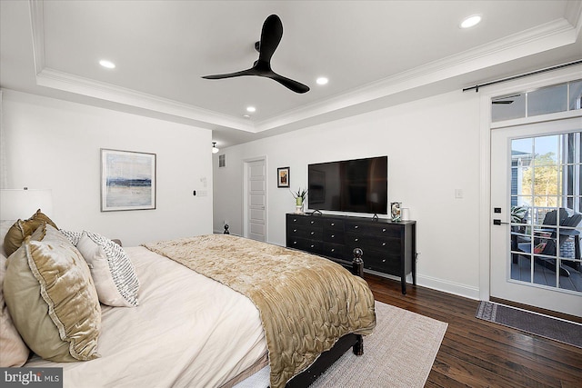 bedroom featuring a tray ceiling, crown molding, recessed lighting, wood finished floors, and access to outside