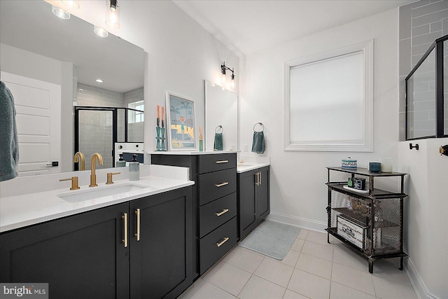 full bath featuring a shower stall, baseboards, tile patterned flooring, and vanity