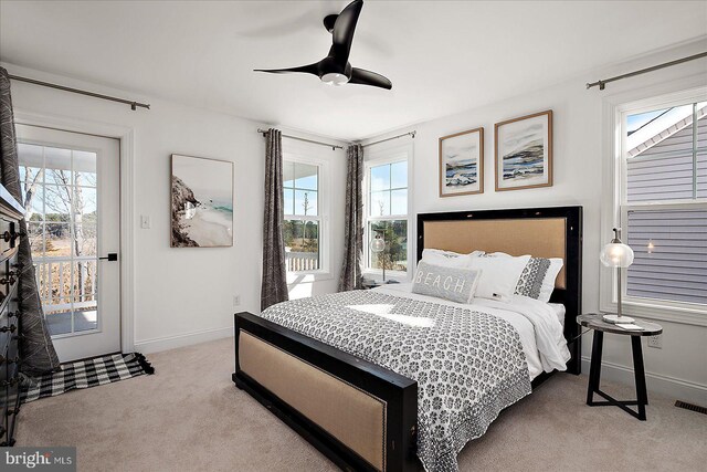 bedroom with carpet floors, ceiling fan, visible vents, and baseboards