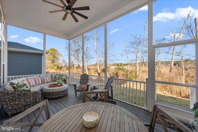 sunroom with a ceiling fan