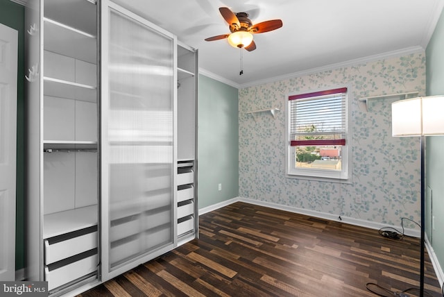 unfurnished bedroom featuring dark hardwood / wood-style flooring, crown molding, and ceiling fan