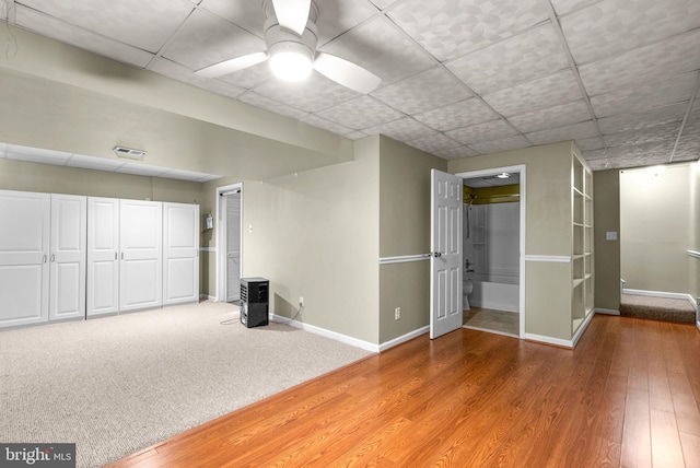 interior space with ceiling fan and hardwood / wood-style floors