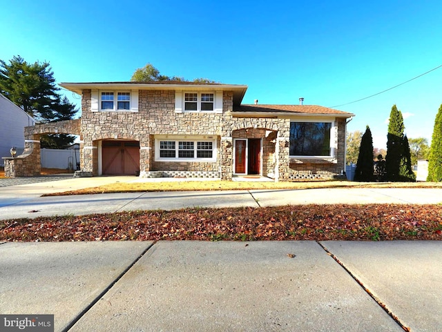 view of front of property with a garage