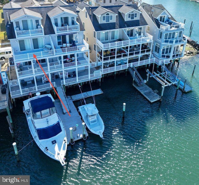 birds eye view of property with a water view