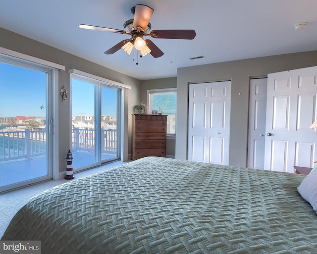 bedroom featuring access to outside, ceiling fan, and carpet flooring