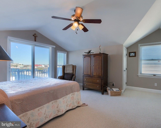 carpeted bedroom with access to exterior, ceiling fan, a water view, and lofted ceiling