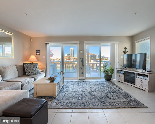 living room with light tile patterned floors and a healthy amount of sunlight