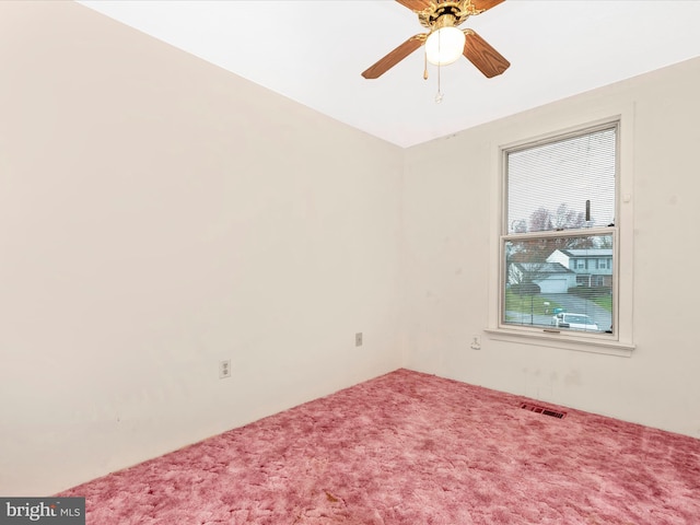 spare room with carpet flooring and ceiling fan