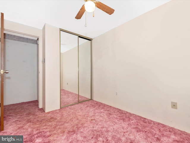 unfurnished bedroom featuring carpet flooring, ceiling fan, and a closet