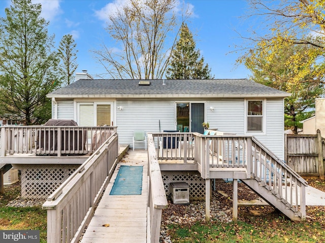 rear view of property with a deck