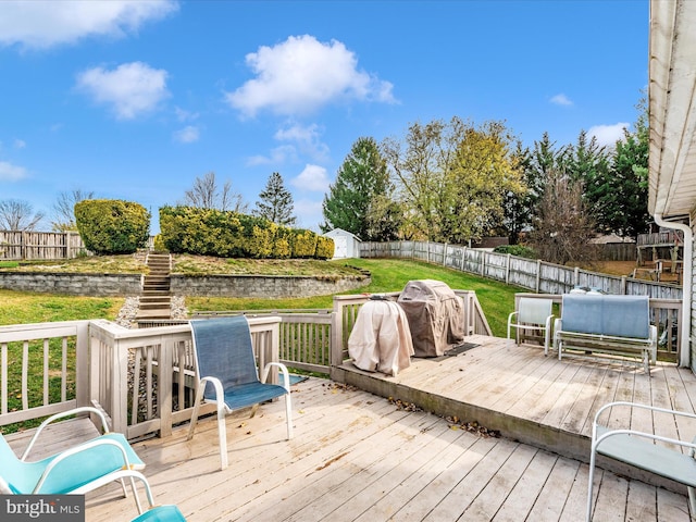 wooden deck with a lawn