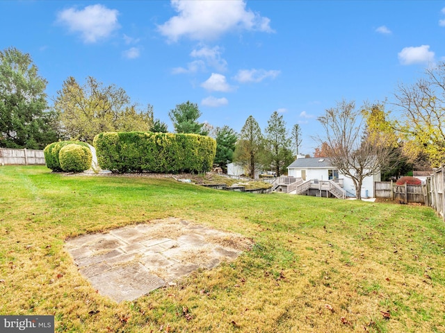 view of yard with a wooden deck