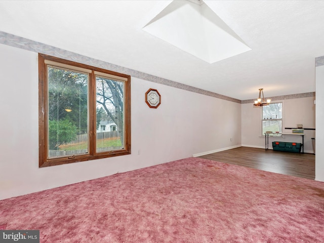 unfurnished living room with a notable chandelier and dark wood-type flooring