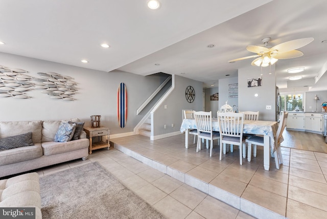 tiled dining area with ceiling fan