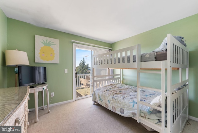 bedroom featuring access to exterior and carpet floors