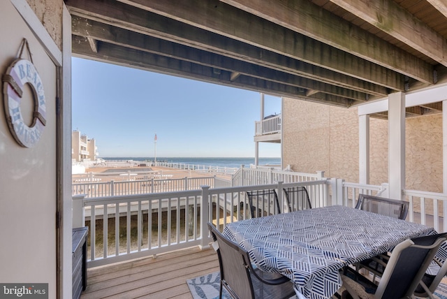 wooden deck featuring a water view