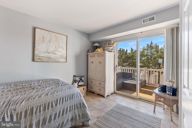 tiled bedroom with access to exterior