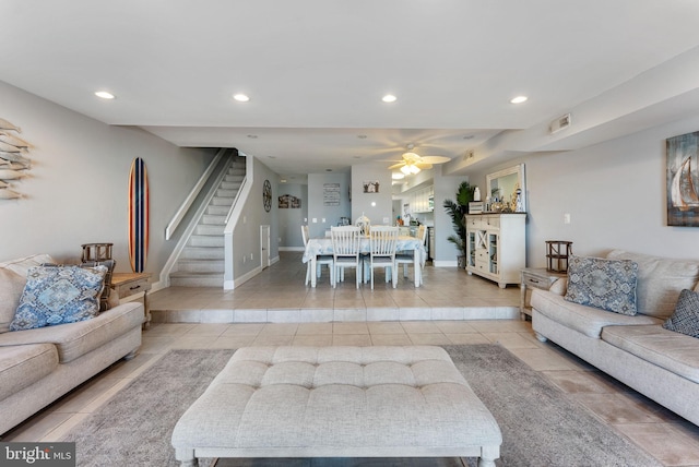 tiled living room featuring ceiling fan