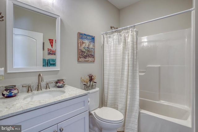 full bathroom featuring vanity, toilet, and shower / bath combination with curtain