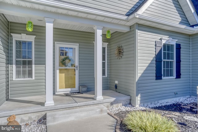 entrance to property featuring a porch