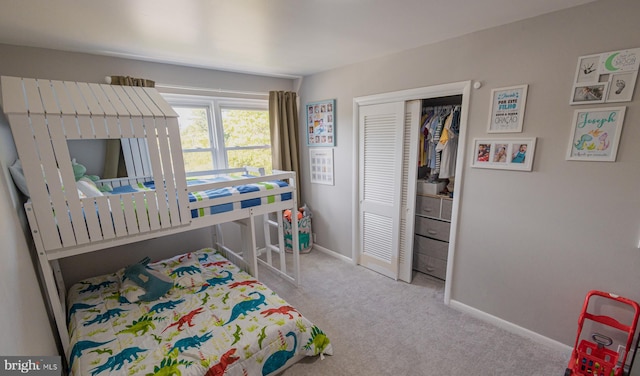 bedroom with light carpet and a closet