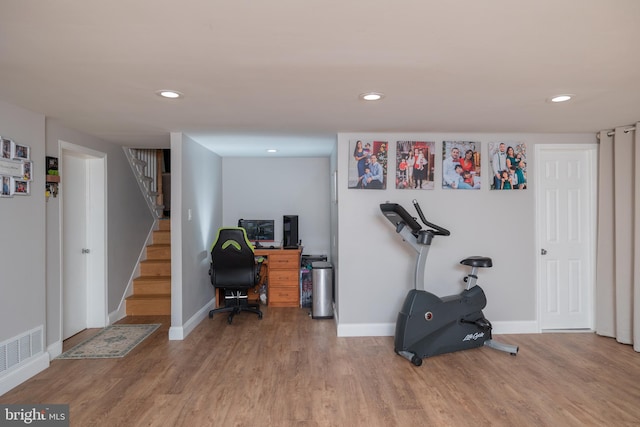 workout room featuring hardwood / wood-style flooring