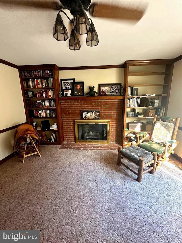 carpeted living room featuring a textured ceiling, a brick fireplace, and crown molding