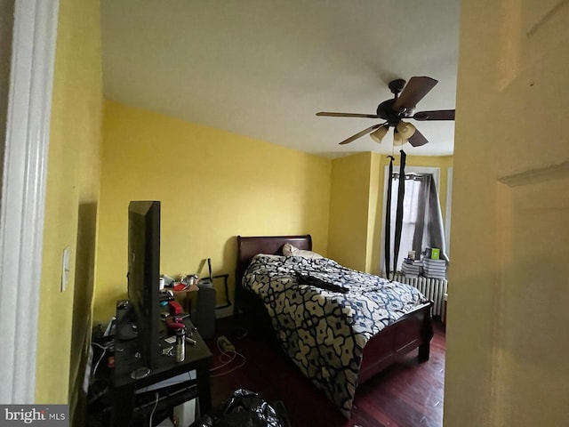 bedroom featuring dark hardwood / wood-style floors and ceiling fan