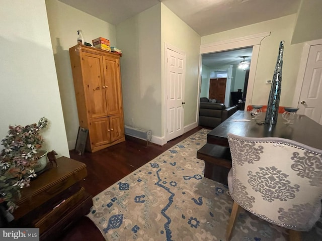 interior space featuring ceiling fan and dark wood-type flooring