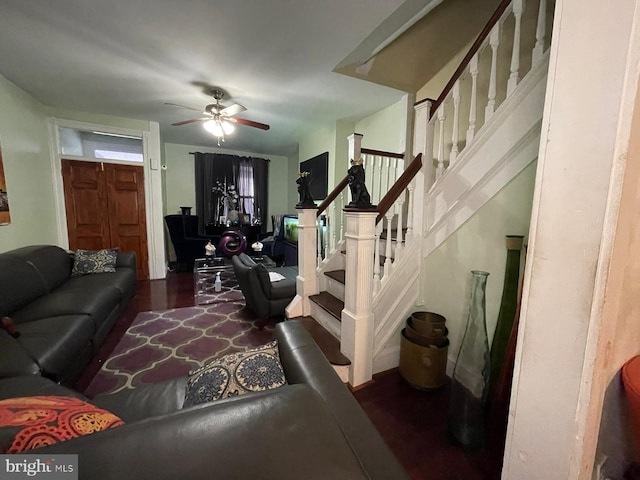 living room featuring hardwood / wood-style floors and ceiling fan